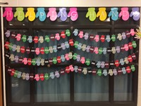 Paper mittens hung up for our families in need for the holiday season called Helping Hands.