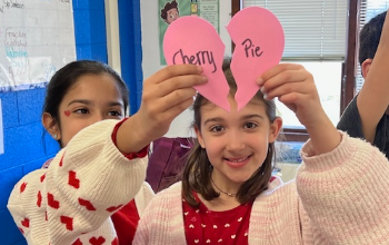 Two students enjoying the Valentine's party.