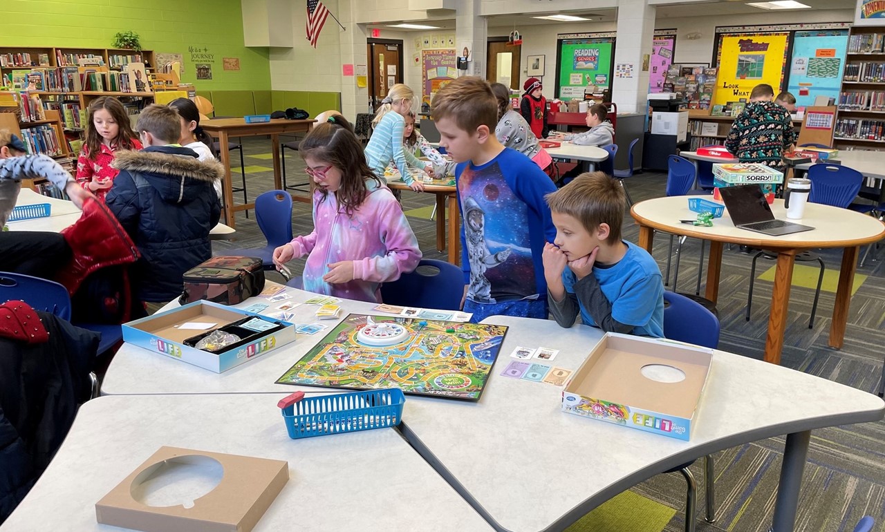 Students learning new board games at Game Club